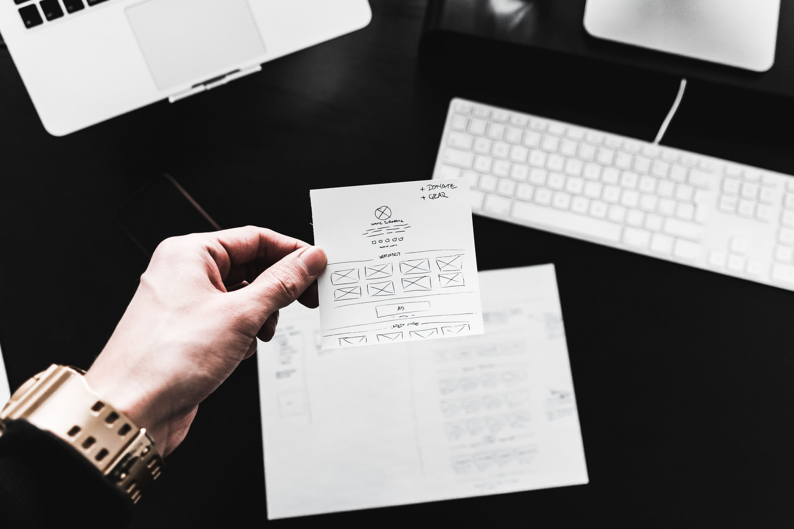 designer-showing-web-design-layout-sketches-picjumbo-com.jpg